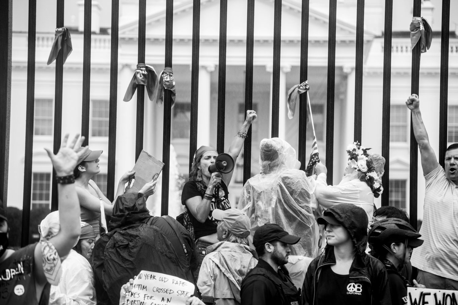 Risking arrest, protestors stood on the fence before the White House and let their anger be heard. Secret Service and Park Police patrolled the protest but let the protestors have their time and space to exercise their First Amendment rights.