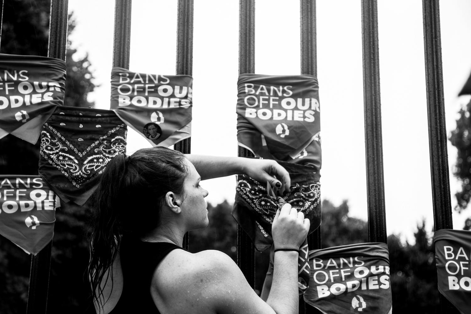 One planned act of disobedience was to tie our Bans Off Our Bodies bandanas to the White House fence in silent protest of losing our human rights of autonomy over our own bodies. 